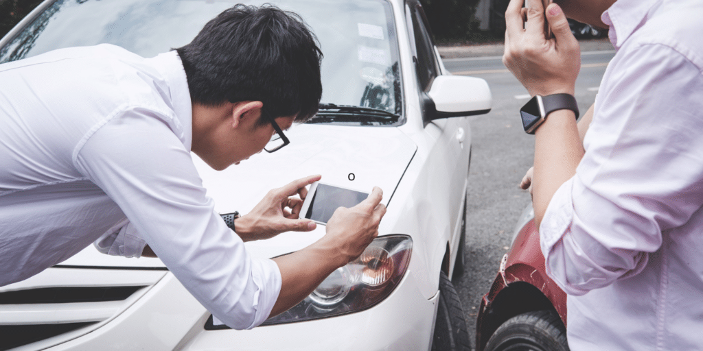 Insurance adjuster taking pictures of a rear-end collision in St. Louis