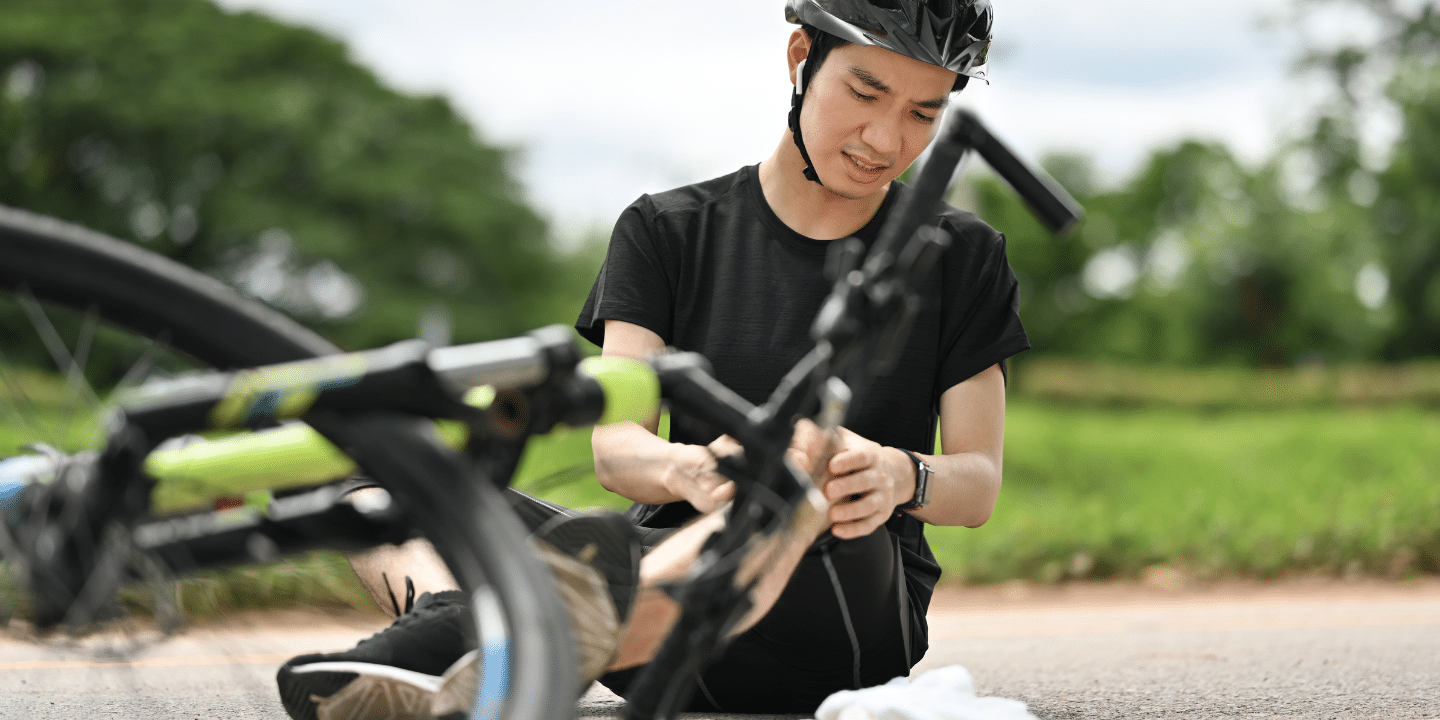 A man riding a bicycle involved in an accident