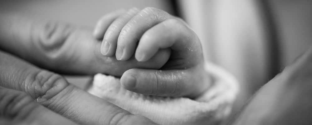 Mother Holding Babys Hand Missouri Shoulder Dystocia Lawyer 